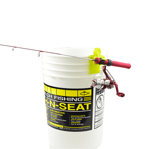 stealth tip up showing a rod affixed to a bucket, with the reel facing downwards
